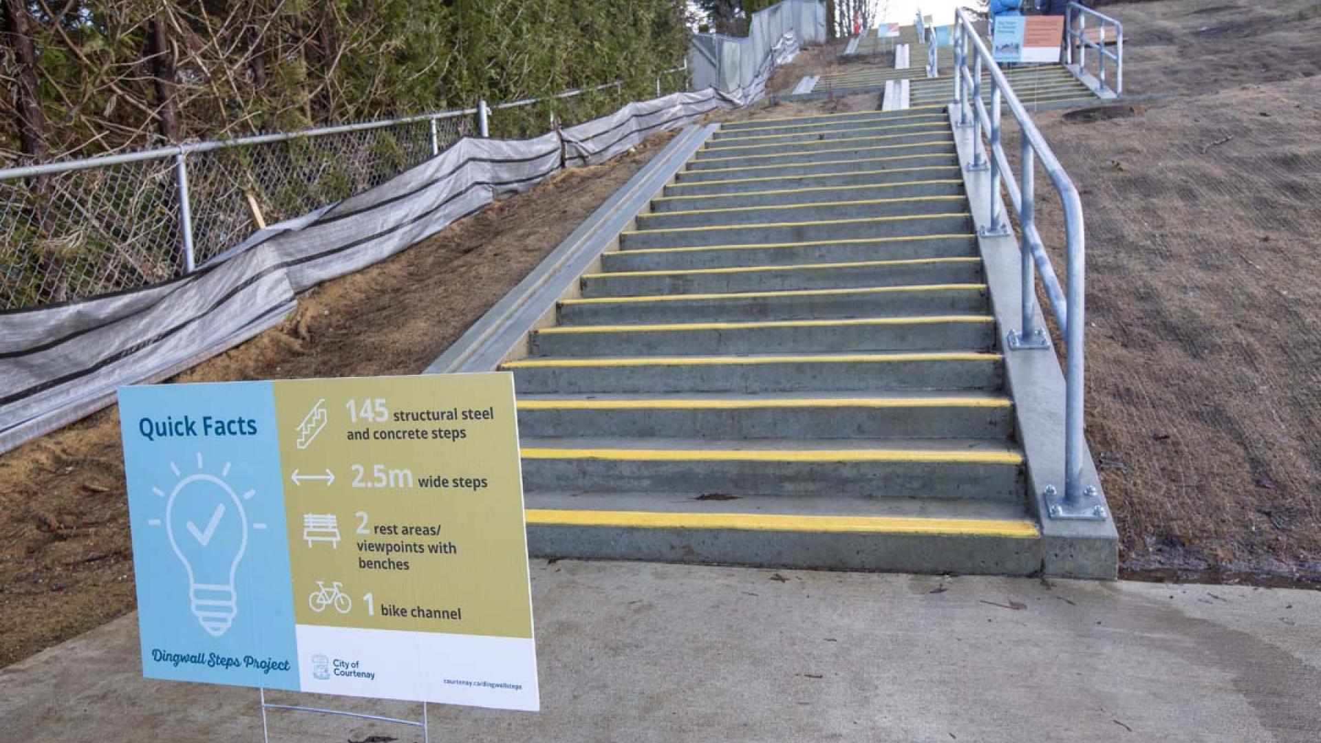 Dingwall steps with a sign detailing quick facts about the benefits of using them.